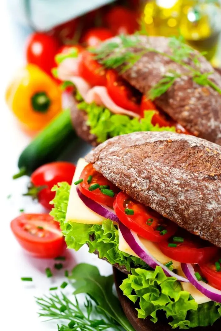 Whole grain sandwiches with vegetables and cheese.